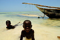 Children bathing on the beach of Jambiani, Zanzibar Island, Tanzania, East Africa