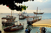 Traditional boats in coastal waters off Zanzibar Town / Stone Town, Zanzibar, Tanzania, October 2008