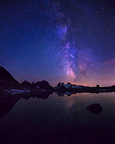 The milky way over alpine lake in the Cascades, Alpine Lakes Wilderness, Washington, August.