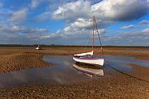 Boat on beach at low tide, Blakeney Point, Norfolk, UK, October 2009
