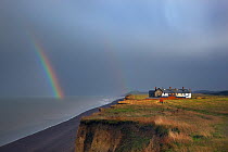 Coastal cottages and path with rainbow over sea, Weybourne Norfolk, November 2012