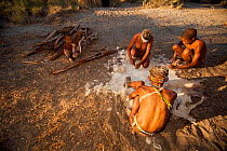 Zu/'hoasi Bushmen prepare the hide of a goat by removing the hair. With restrictions on the animals that they are allowed to hunt, Bushmen communities rely on these animals for food, clothing, quivers...