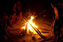 Zu/'hoasi Bushmen carry out a traditional Trance Dance. Women clap and sing by a fire while men dance in a circle in preparation for a Sangoma (Zulu healer) to perform traditional healing while in an...