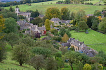 View of the village of Naunton, showing the village church of St. Andrew's, Cotswolds, Gloucestershire, October 2012