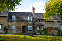 Burford, a village in the Cotswolds, showing the cottages at the top end of the high street, Oxfordshire, England, October 2012