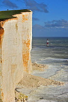 View over the eroded white chalk cliffs and lighthouse at Beachy Head, Sussex, England, UK November 2012