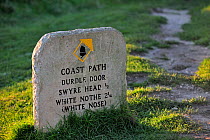 Stone signpost for coastal footapth at Durdle Door  near Lulworth on the Isle of Purbeck, Jurassic Coast World Heritage Site, Dorset, UK