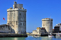 The medieval towers Tour de la Chaine and Tour Saint-Nicolas in the old harbour at La Rochelle, Charente-Maritime, France, September 2012