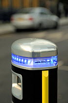 Elektrobay electric vehicle recharger with silver car in background, London, UK