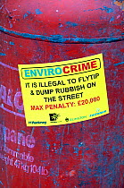 Envirocrime label stuck onto a cylinder with inflammable contents dumped in street London Borough of Islington, UK