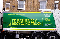Waste collection vehicle with environmental recycling message, Highbury, London Borough of Islington, UK