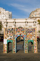 Marble Arch replica built from litter collected from nearby Oxford Street and which will hopefully be recycled when the structure is dismantled, Central London UK, November 2011