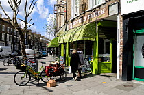 Mother Earth Organic Health Food Shop with delivery bike in front, Newington Green, London Borough of Islington, UK