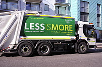 Rubbish collection vehicle with Less is More printed on the side advertising recycling, London Borough of Islington, UK