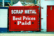 Scrap Metal Yard behind red painted gate Highbury, London Borough of Islington, UK