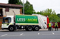 Waste Truck with recycling slogan on the side, working at the rear Highbury, London Borough of Islington, UK