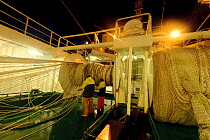 Shetland pelagic trawler 'Charisma' fishing for Atlantic mackerel (Scomber scombrus) at night, near Shetland Isles, Scotland, UK, October 2012. Model released.