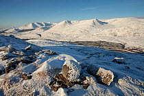 View over Loch Laggan towards Creag Megaidh and surrounding mountains in winter, with Binnein Shuas in foreground, Creag Megaidh National Nature Reserve, Badenoch, Scotland, UK, December 2010.