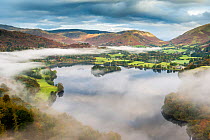 View from Loughrigg, with autumn colour and morning mist over Grasmere, The Lake District, Cumbria, UK. October 2012.