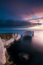 Old Harry Rocks, in early morning light and stormy sky, The Purbecks, Dorset, UK. May 2012.