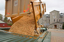 Delivery of wood chips for use by local hotel to supply heating, Kingussie, Scotland, UK, May.