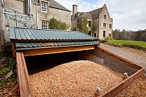 Wood chips in store, used as fuel, Alvie estate, Scotland, UK, May..