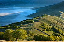 The Piano Grande at dawn with mist lying in the valley, Monti Sibillini National Park, Umbria, Italy May 2012