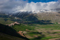 Looking across the valley to Castelluccio and the Piano Grande, Monti Sibillini National Park, Umbria, Italy, May 2012
