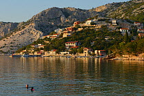 People swimming along the Adriatic coast, Velebit Nature Park, Rewilding Europe area, Velebit mountains, Croatia, June 2012