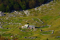 Abandoned farm and grazing lands, now only used as summer cottage, Alan, North Velebit National Park, Velebit Nature Park, Rewilding Europe area, Velebit mountains, Croatia June 2012