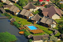 Aerial over Green Village lodge, Sfinthu Gheorghe, within the Danube delta rewilding area, Romania June 2012