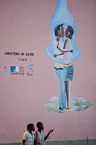 HIV / AIDS awareness campaign, graphics painted onto side of building on the edge of the market square, Sao Tome, Democratic Republic of Sao Tome and Principe, Gulf of Guinea 2009