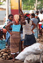 Women primarily control the sale of charcoal and wood in Sao Tome market, Sao Tome, Democratic Republic of Sao Tome and Principe, Gulf of Guinea. Lack of cooking fuels puts pressure on natural resourc...