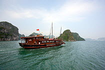 Junk boat in Ha Long Bay, a UNESCO World Heritage Site, and a popular travel destination, located in Quang Ninh province, Vietnam.