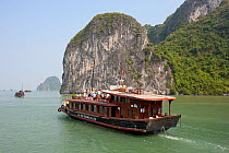 Junk boat  in Ha Long Bay, a UNESCO World Heritage Site, and a popular travel destination, located in Quang Ninh province, Vietnam.
