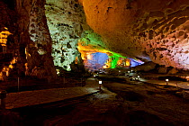 Inside floodlit Sung Sot Cave in Ha Long Bay, a UNESCO World Heritage Site, and a popular travel destination, located in Quang Ninh province, Vietnam.