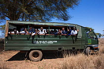 Kenyan schoolchildren visit the bush on World Rhino Day as part of community education drive on rhinos, Lewa Wildlife Conservancy, Laikipia, Kenya, Africa, September 2012