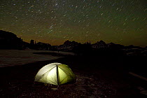 Night time view of a campsite tent on the Death Canyon Shelf along the Teton Crest Trail in Grand Teton National Park. Wyoming, USA, July 2011