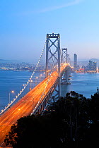 Oakland Bay Bridge at dusk, looking over to city of San Francisco, California, USA 2011