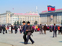 People walking across Kim Il Sung Square in the capital city of Pyongyang, Democratic Peoples' Republic of Korea (DPRK), North Korea, April 2012