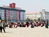 People in Kim Il Sung Square in the capital city of Pyongyang, Democratic Peoples' Republic of Korea (DPRK), North Korea 2012
