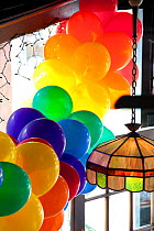 Rainbow coloured balloons in Castro Street, signifying San Francisco Gay Pride (Lesbian, Gay, Bisexual and Transgender Pride Celebration) annual parade and festival end of June, San Francisco, Califor...