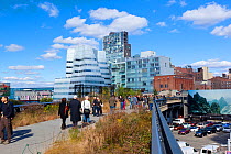 People walking on the High Line, a mile long New York City park on a section of former elevated railroad along the Lower West Side, New York, USA, October 2011