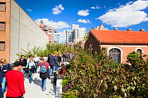 People walking on the High Line, a 1-mile New York City park on a section of former elevated railroad along the Lower West Side, New York, USA, October 2011
