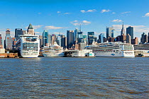 Luxury cruise liners infront of Midtown Manhattan across the Hudson River, New York, USA, October 2011
