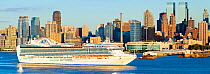 Panoramic view of luxury cruise liner infront of Midtown Manhattan across the Hudson River, New York, USA October 2011
