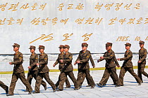 Uniformed men marching at Revolutionary Martyrs' Cemetary, Democratic Peoples' Republic of Korea (DPRK), North Korea, April 2012