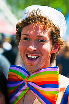 Man dressed up wearing rainbow coloured bow tie, celebrating Lesbian Gay Bisexual Transgender Pride Parade, an annual event, San Francisco, California, USA, June 2011