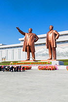 Mansudae Grand Monument - people bowing to giant statues of former Presidents Kim Il-Sung and Kim Jong Il, Mansudae Assembly Hall on Mansu Hill, Pyongyang, Democratic Peoples' Republic of Korea (DPRK)...