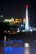 Juche Tower and Taedong river illuminated at night, Pyongyang, Democratic Peoples' Republic of Korea (DPRK), North Korea 2012